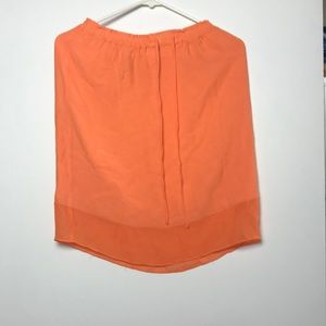 Worn orange skirt. Size 6 woman’s.
